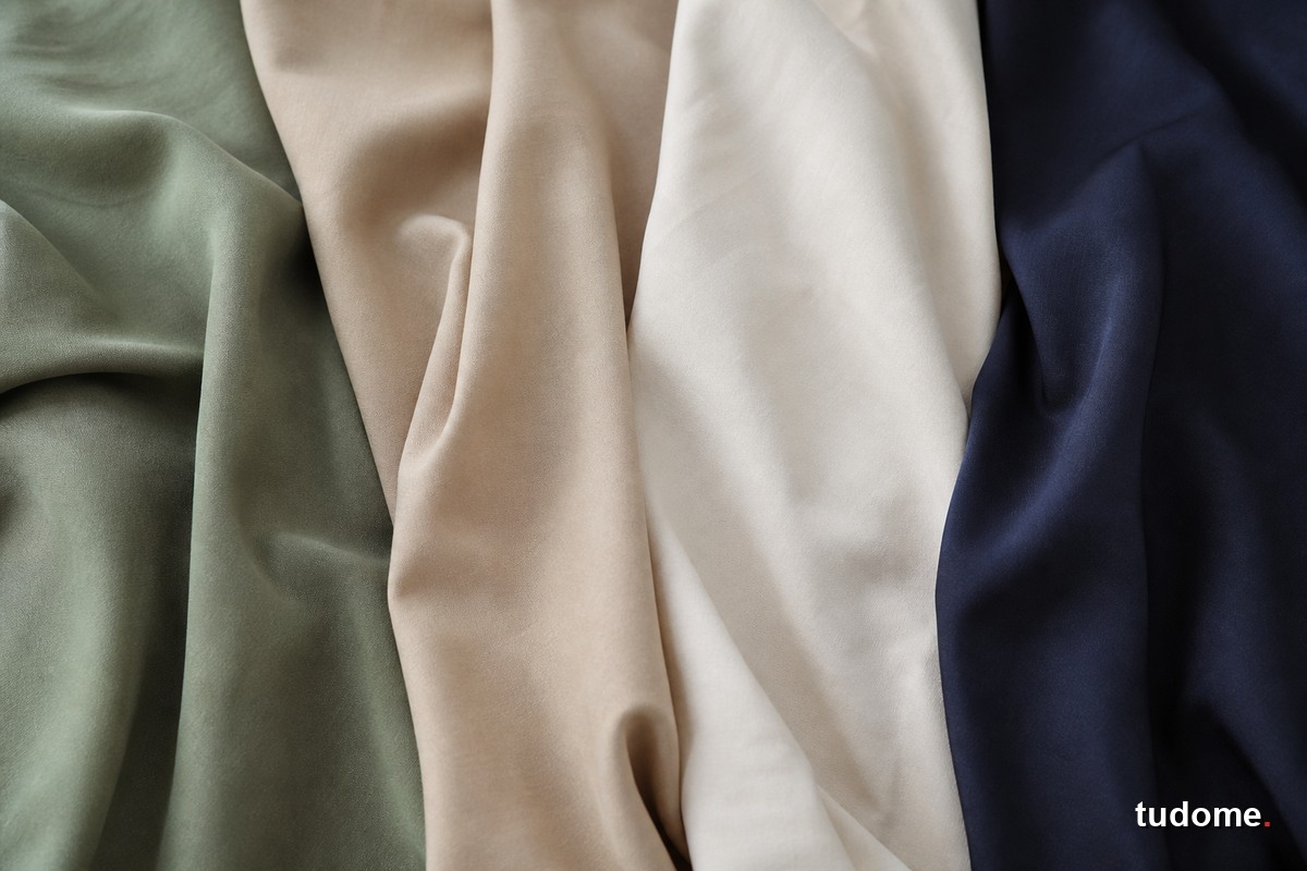Các mẫu vải tencel màu xanh sage, be, trắng và navy
